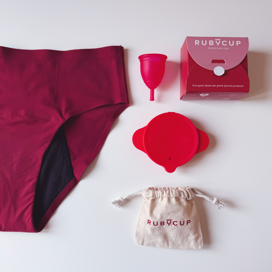 Ruby Cup Starter Pack with red menstrual cup, sterilizer, and Flow Freedom period underwear
