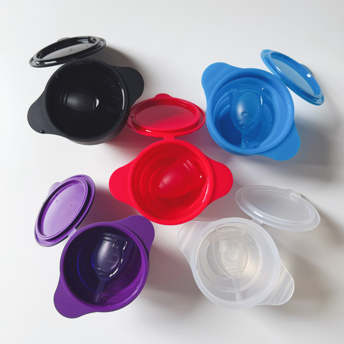 Ruby Cup sterilisers and menstrual cups in different colours